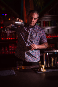 Bartender mixing tiki drink at Coral Club